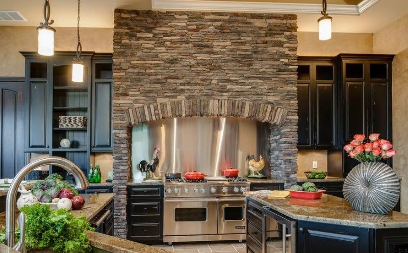 Imitation of a fireplace in the kitchen interior of a city apartment