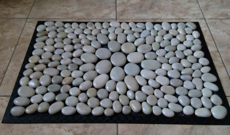 Pebble rug on bathroom floor