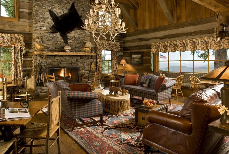 The design of the living room in a wooden house in a hunting style