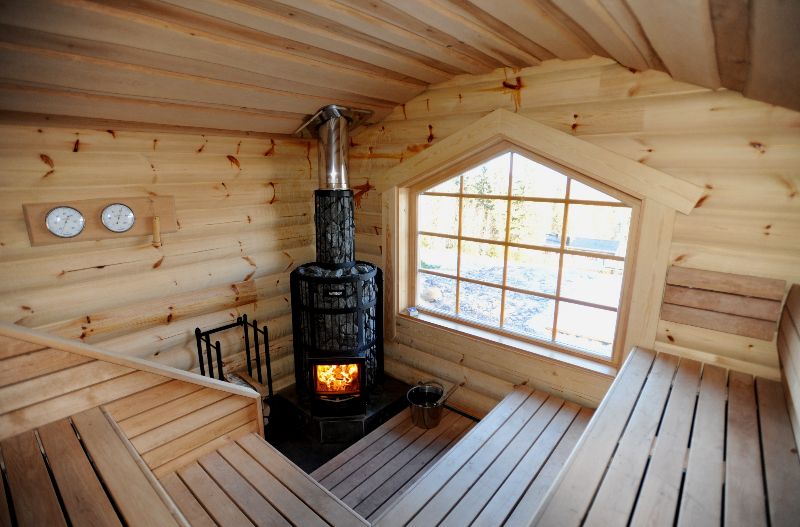 Steam room interior with metal stove