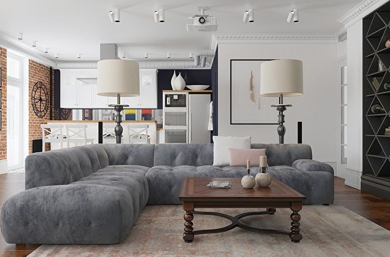 Gray corner sofa in a studio apartment