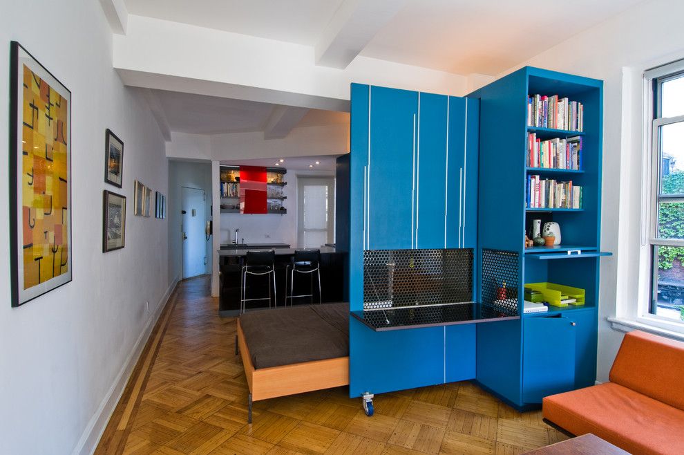 Blue wardrobe in the interior of a white room