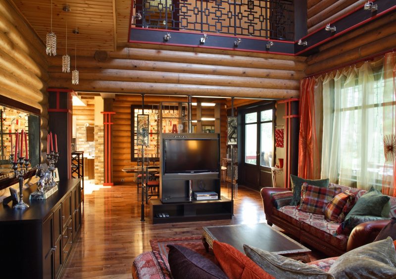 TV stand in the living room of the log house