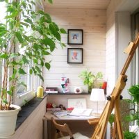 Creative corner on the balcony of a city apartment