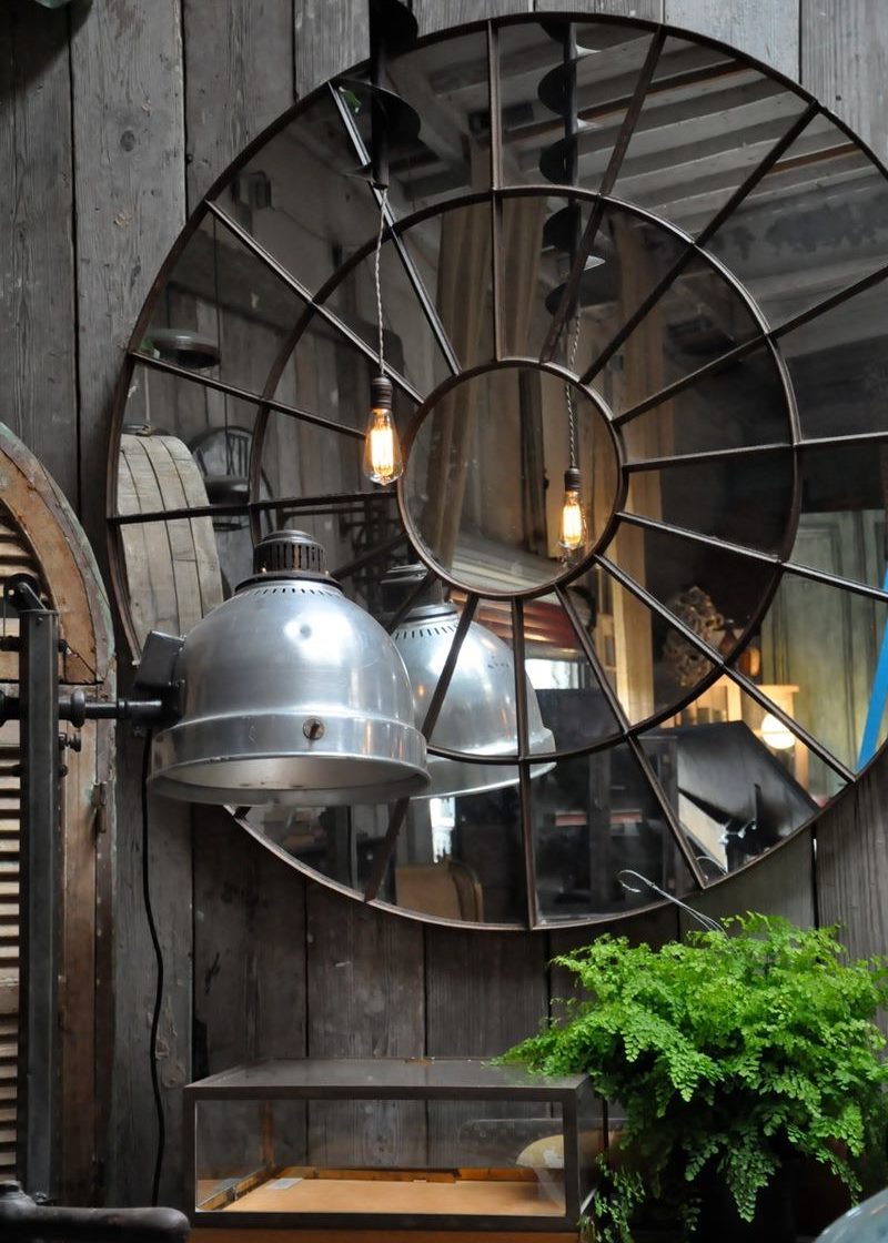 Decoration of mirrors on a wooden wall