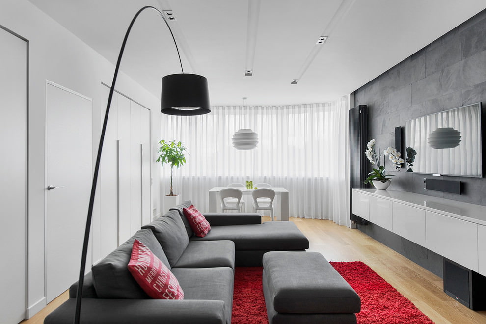 Gray sofa on burgundy carpet in the living room