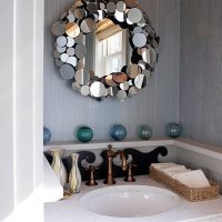 Small washbasin in the bathroom of a city apartment