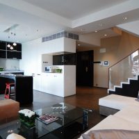 Black furniture in the kitchen-living room