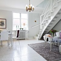 Scandinavian-style living room with staircase