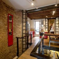 Brick and wood in the interior design of the apartment