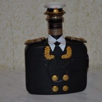 Bottle in a tunic for a gift to a man