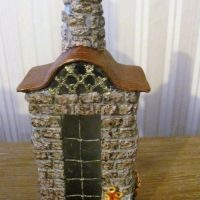 Decor bottle in the form of a house with a window