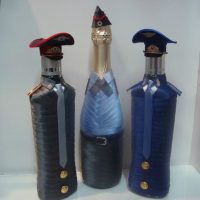 Three bottles in satin ribbons