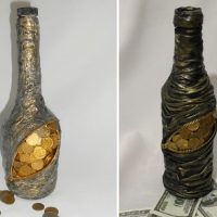 Decoration of a bottle under a purse with coins