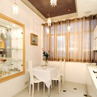 Brown tulle on the window of a white kitchen