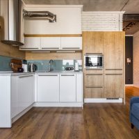 Work area with a corner layout in the kitchen-living room