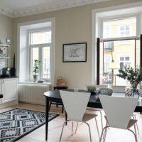 Black dining table in the interior of the kitchen