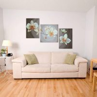 Gray sofa on the laminate floor