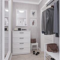 White dresser in the interior of the hallway