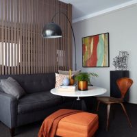 Dark gray sofa and white round table