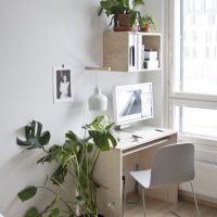 Desk in the bedroom with fresh flowers