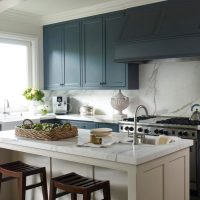 White kitchen island in a gray room