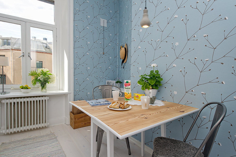 Kitchen dining area with blue wallpaper