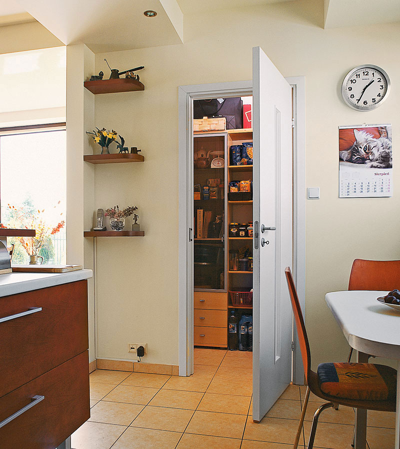 Ceramic tiles on the kitchen floor with pantry