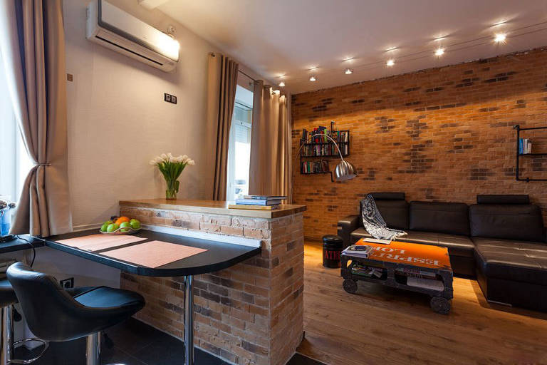 Brick bar counter in the interior of the kitchen-living room