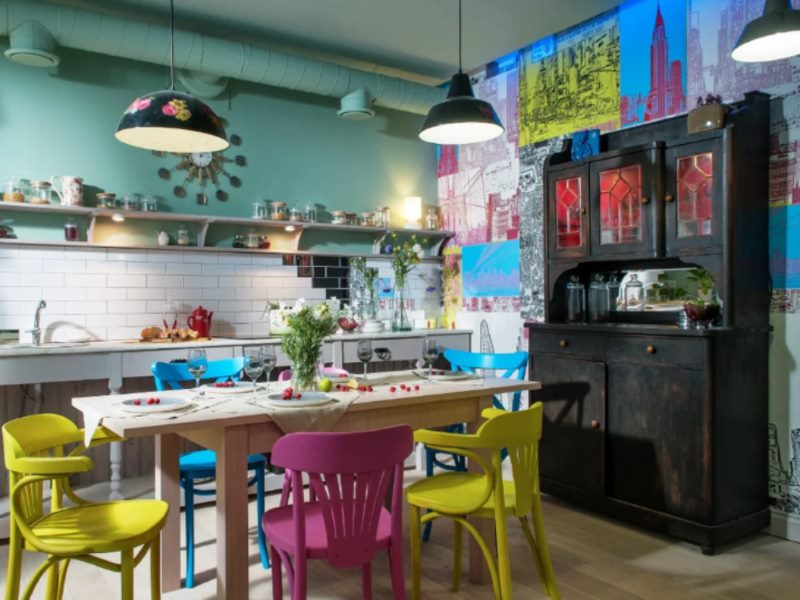 Colorful chairs in the kitchen in the style of kitsch.