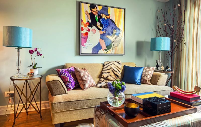 Blue lampshades in the living room with a beige sofa