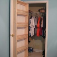 Do-it-yourself wooden shelves on the door to the pantry