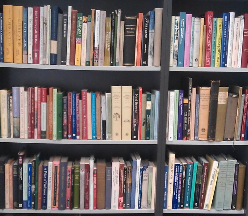 Books on wooden shelves in the pantry