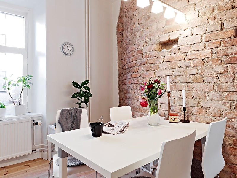 Brick wall highlighting dining area