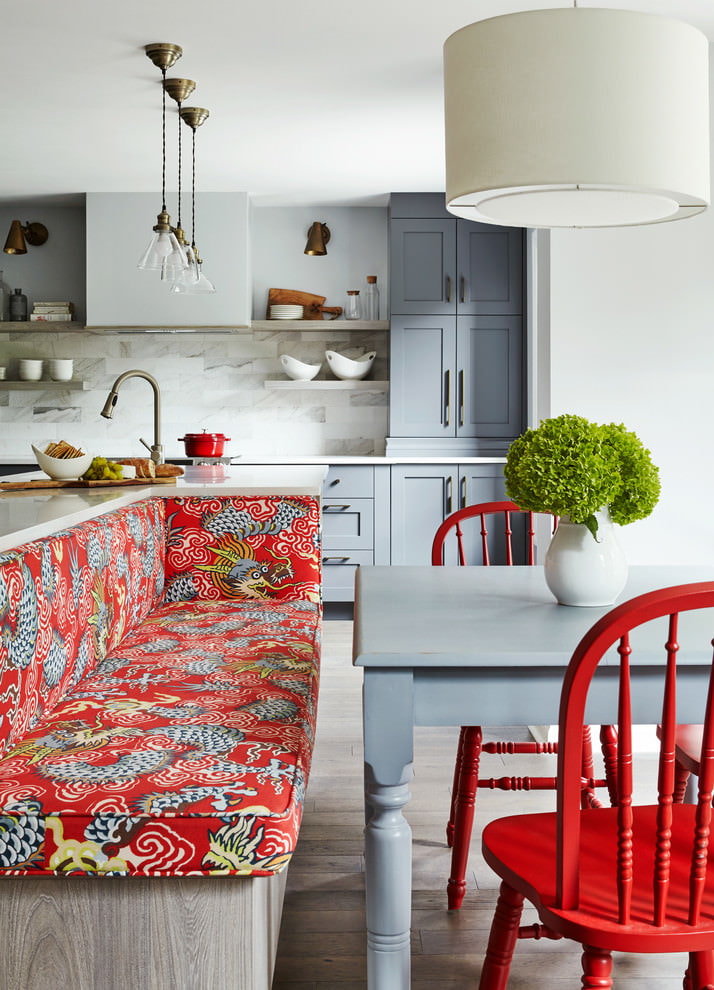 Bright furniture in the interior of the gray kitchen