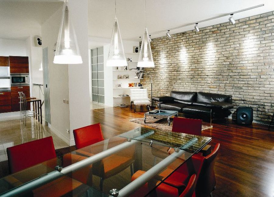 Black leather sofa in the high-tech living room