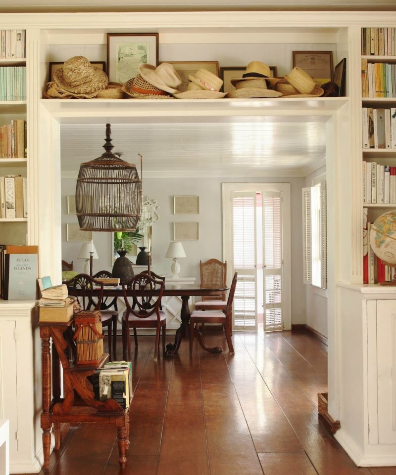 Shelf with hats over the doorway