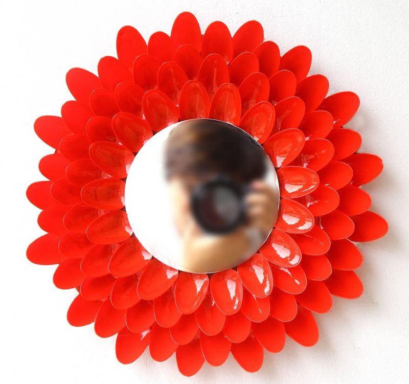 Decorative frame for a mirror from disposable spoons