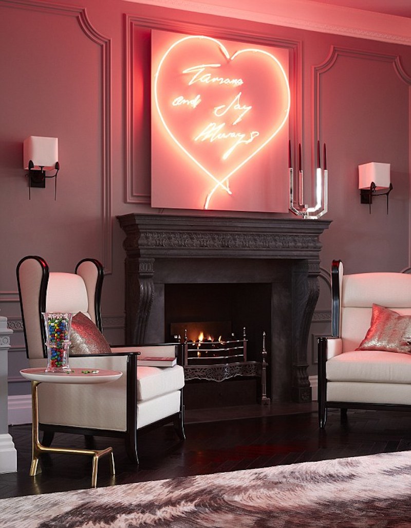 Neon heart over the fireplace in the living room