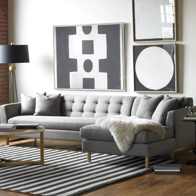 Fur cape on a gray sofa in a small living room