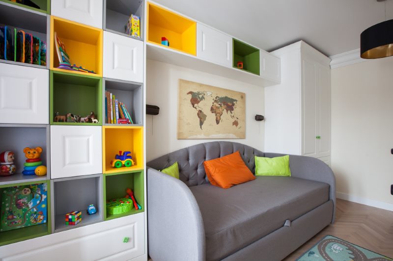 A small gray sofa in the children's room