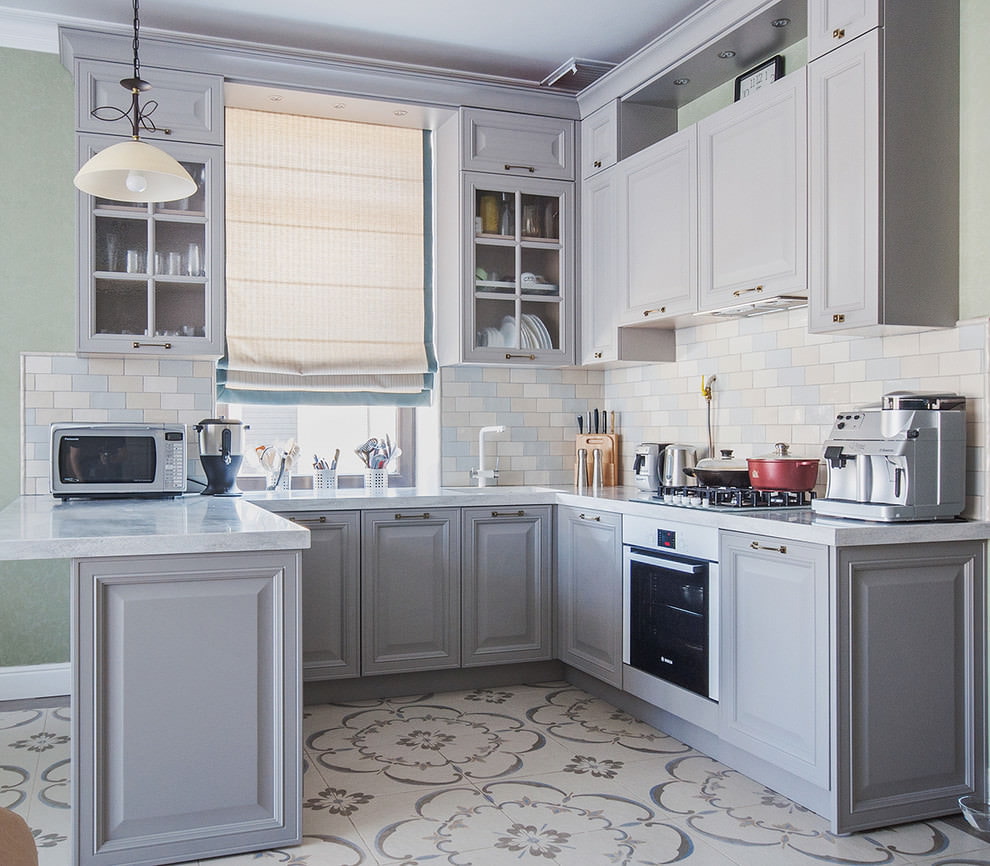 Gray kitchen with island and sink near the window