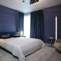 Blue curtains in a modern bedroom