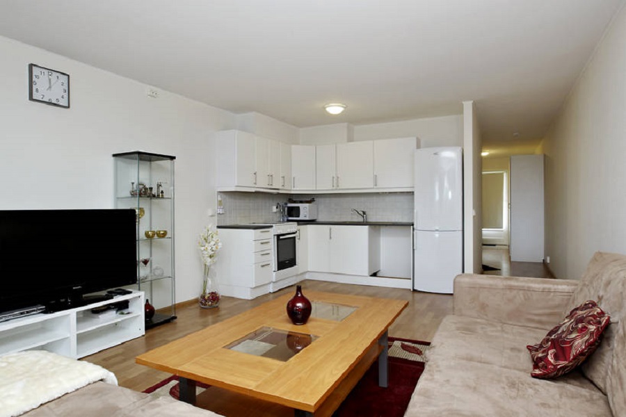 White kitchen corner set in the kitchen-living room 20 sq m