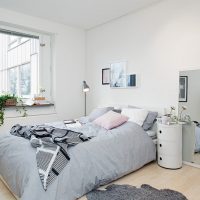 Floor mirror in the bedroom interior