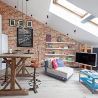 Brick wall in the attic interior