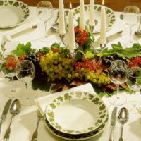 Candles and grapes on the festive table