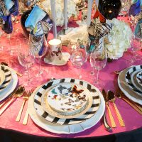 Cutlery with gilding on the table in the living room