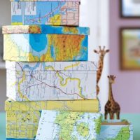 A stack of decorative boxes on a dresser in the living room