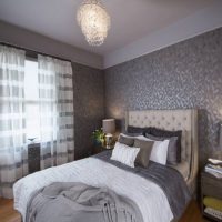 Gray-white curtains in the interior of the bedroom